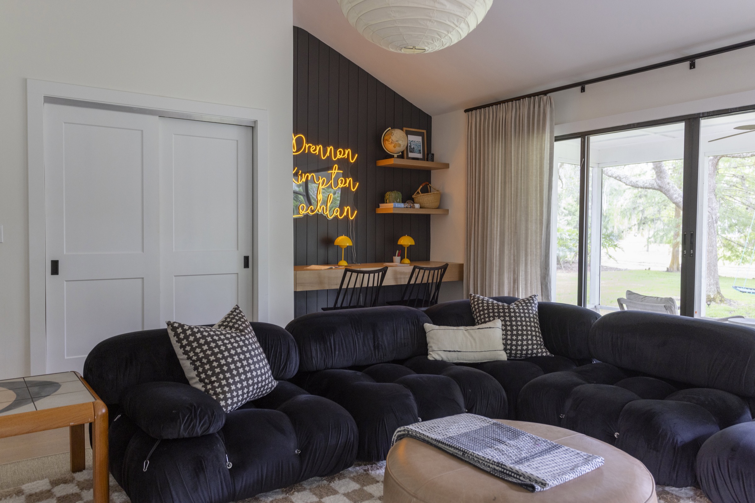 Modern living room with stylish furniture and decor accents.