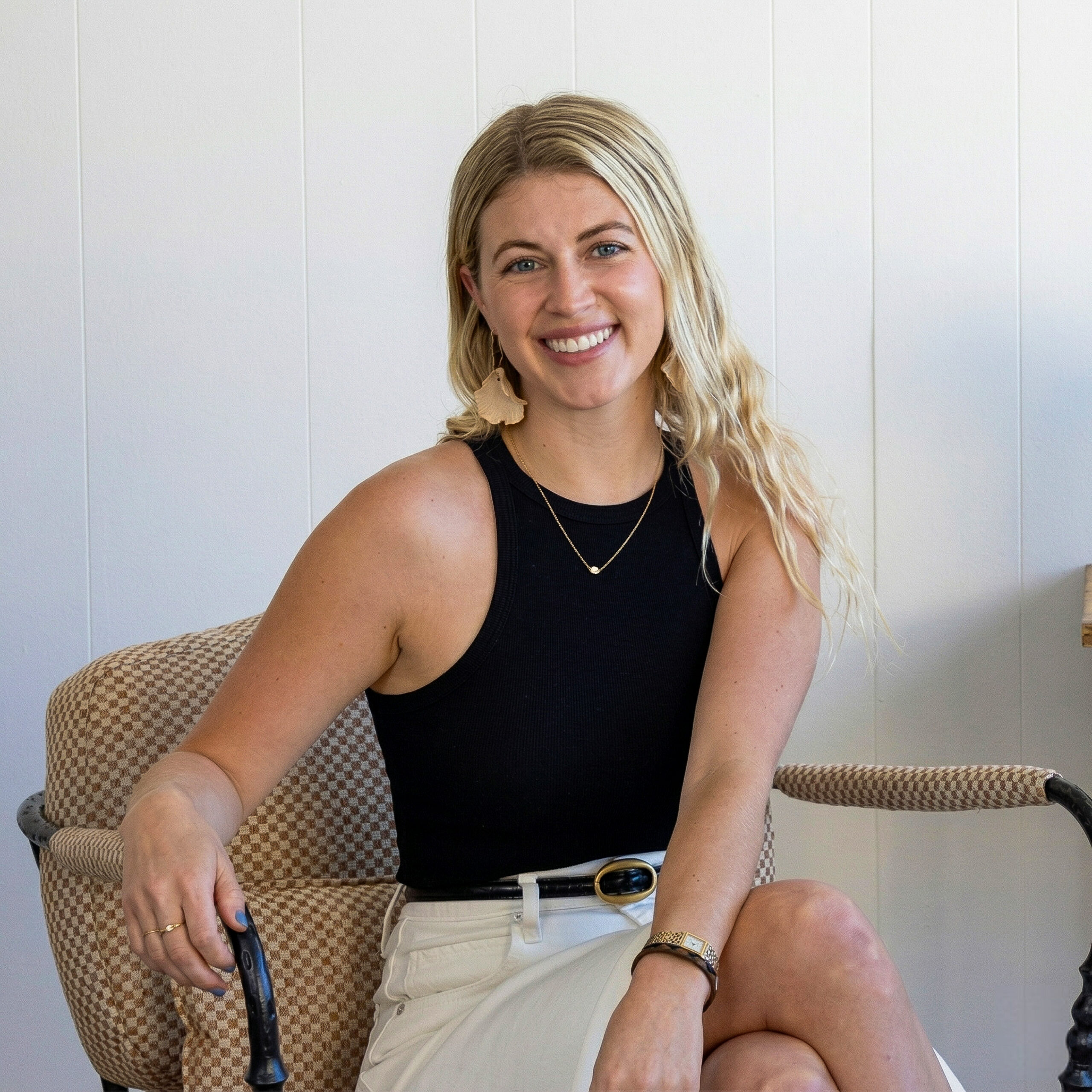 Portrait of Chloe Darché Maggs at South Harlow Interiors showroom.