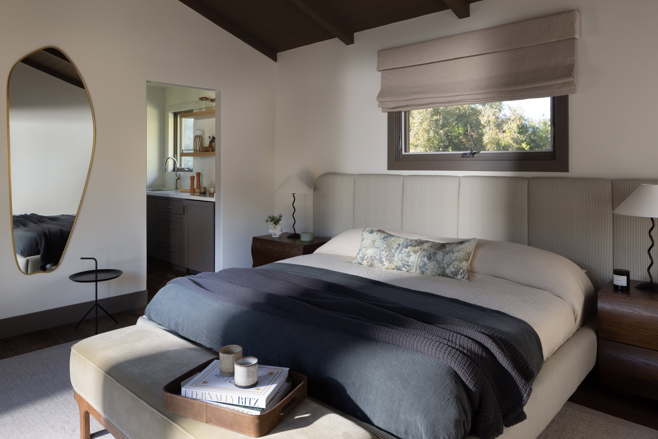 Elegant bedroom with contemporary design, soft lighting, and cozy furnishings for a relaxing atmosph.