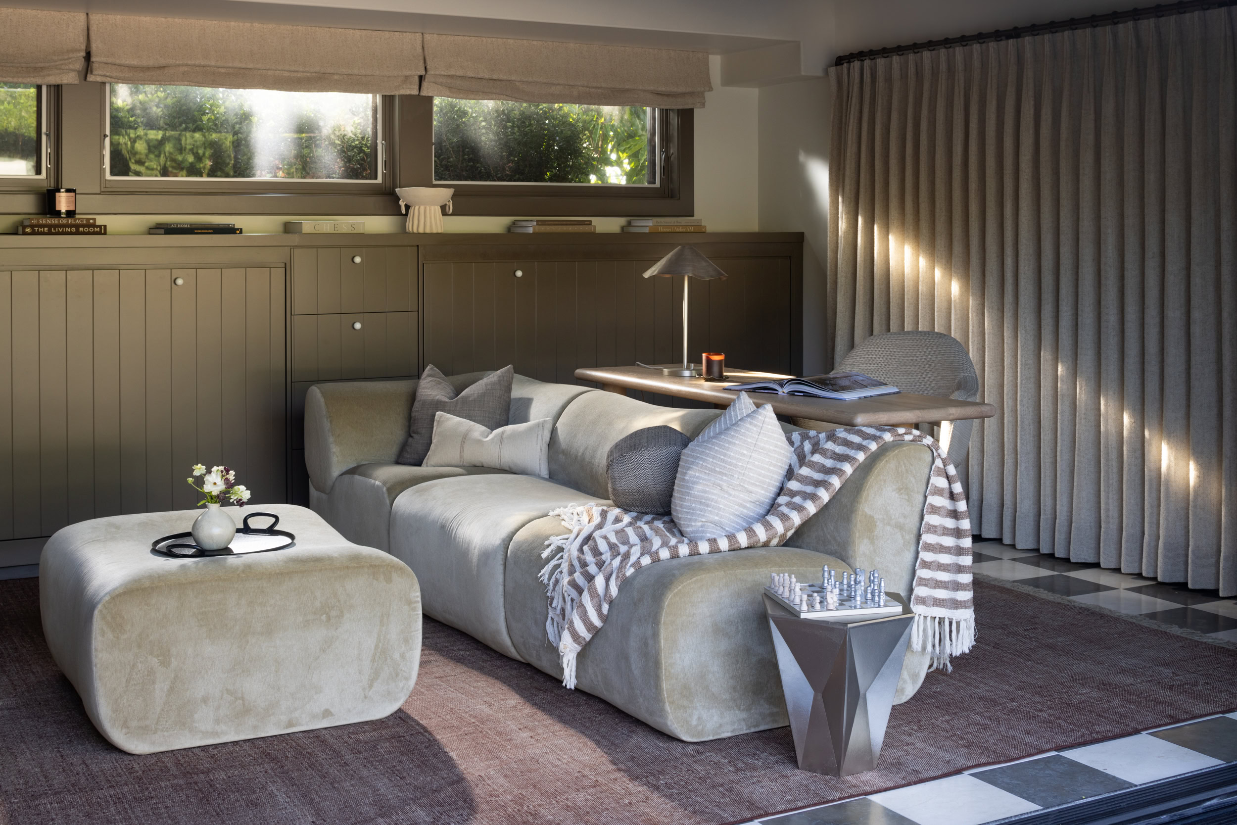 Elegant living room interior showcasing contemporary furniture and soft lighting.