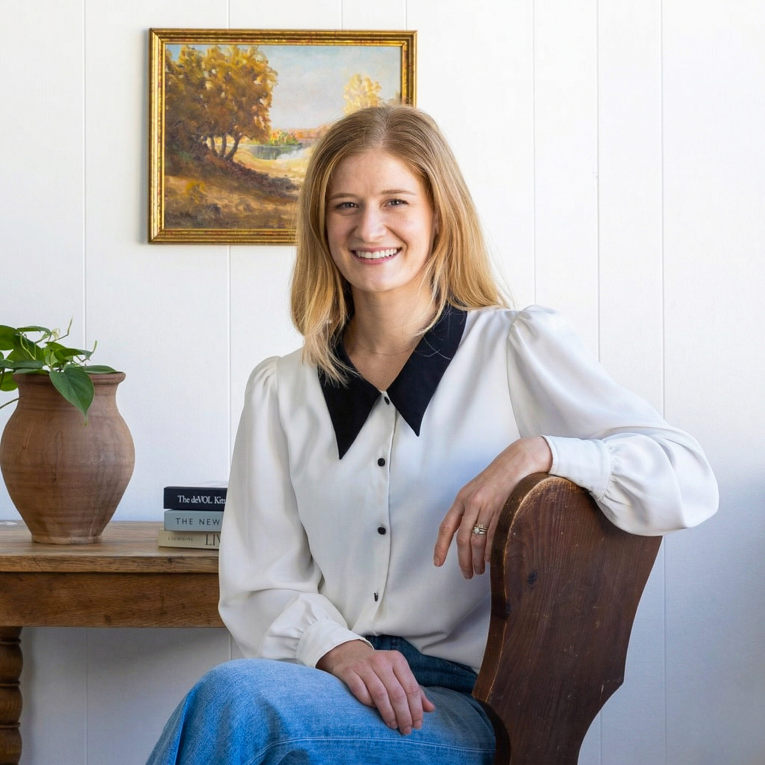 Portrait of Chloe Darché Maggs in interior design setting at South Harlow Interiors.