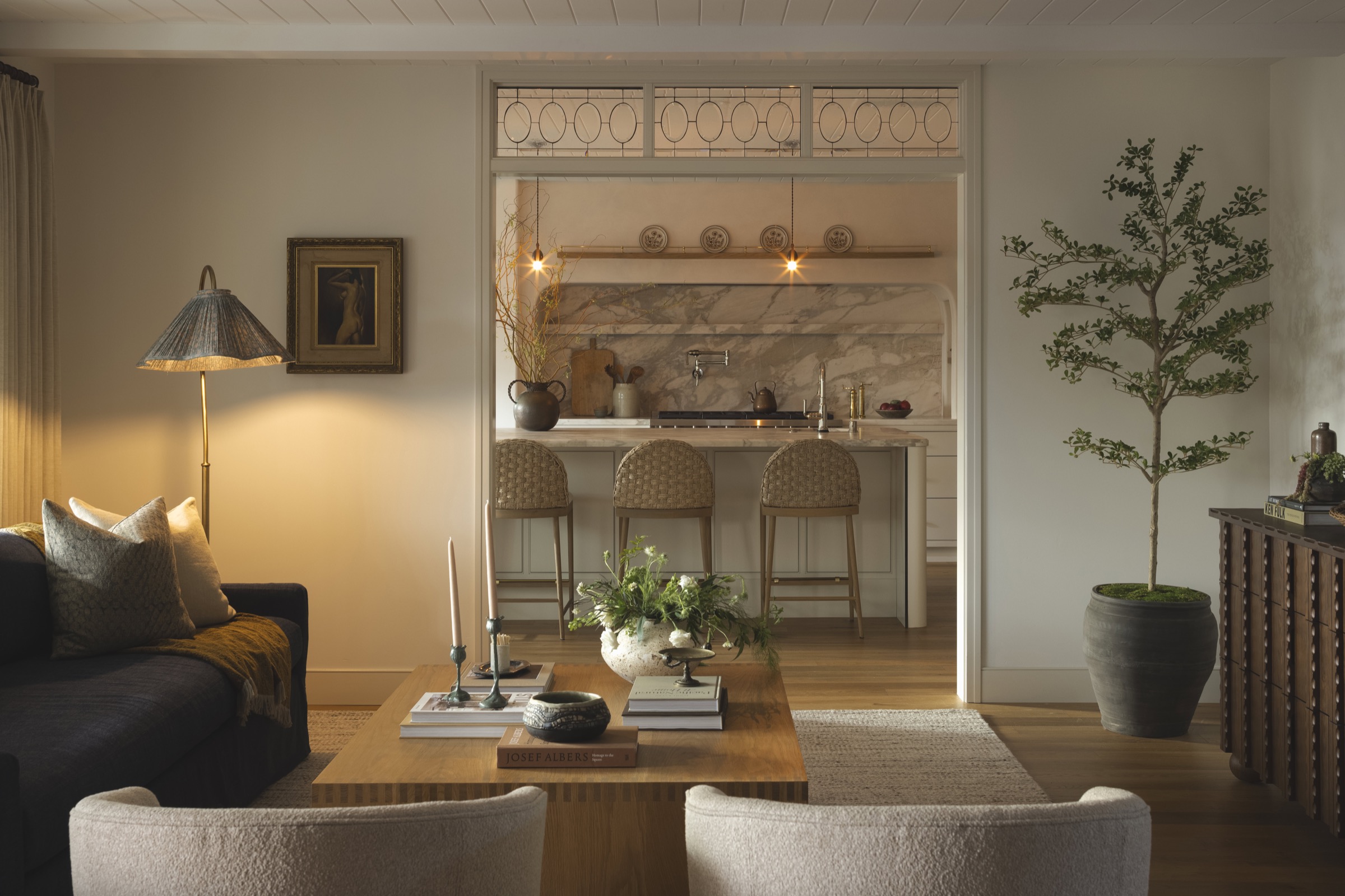 Stylish living room with open-plan kitchen and contemporary decor.