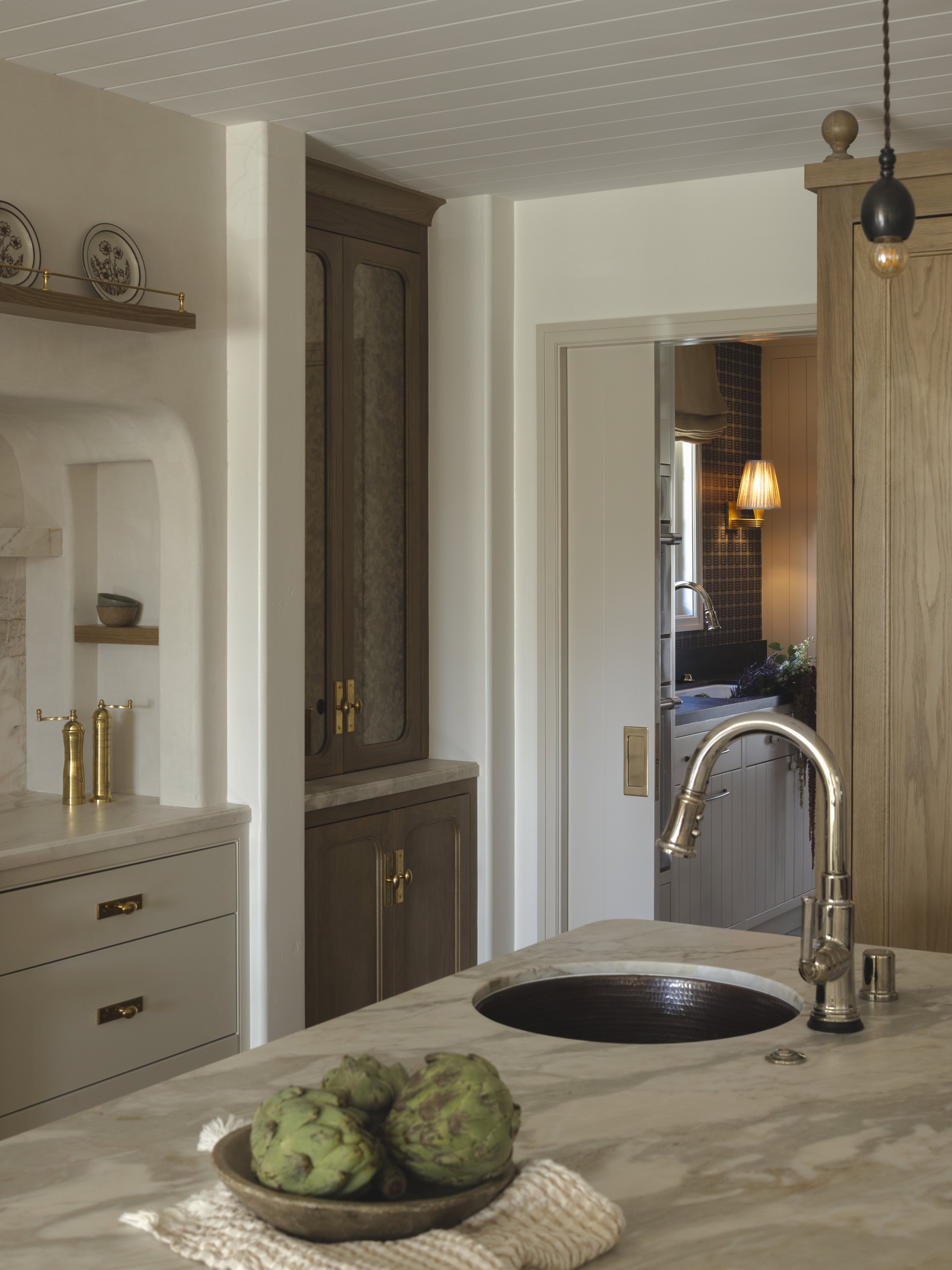 Kitchen interior with elegant cabinetry and natural wood accents.